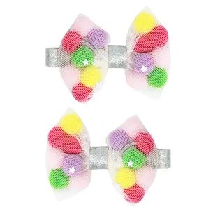 POM POM SPARKLE BOW HAIR CLIPS